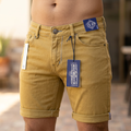 Close-up of Latin model wearing stylish jeans from waist to below belly button, outdoors with soft natural lighting highlighting denim texture.